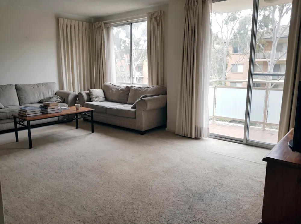 Illustrative: the same living area dried and restored, after remediation